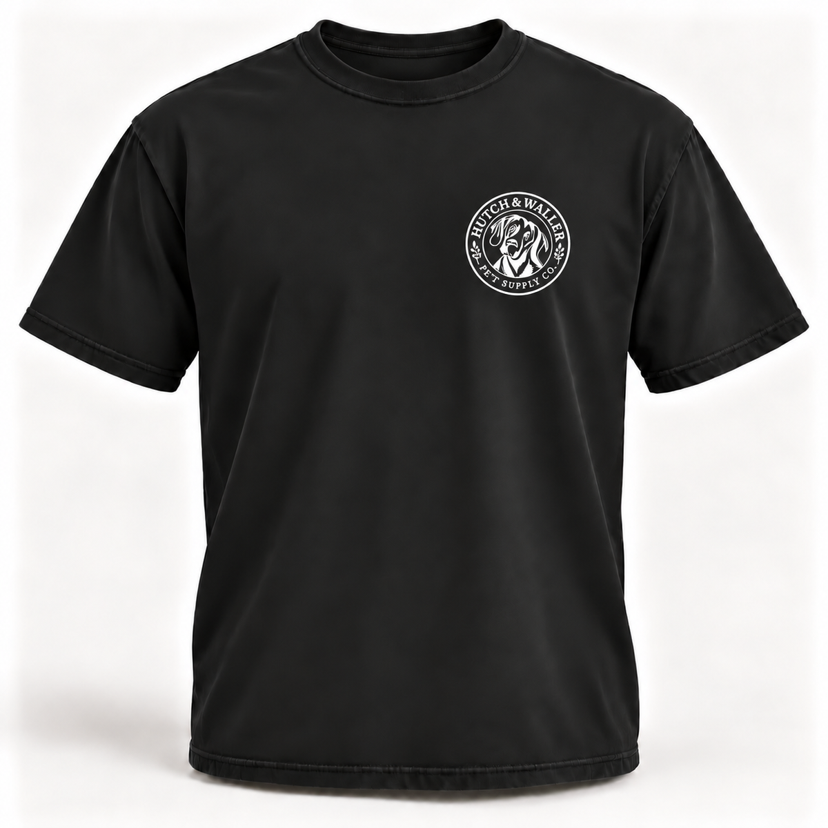 Hutch & Waller Classic Badge T-Shirt in Black, white single-color left-chest badge, revised mockup