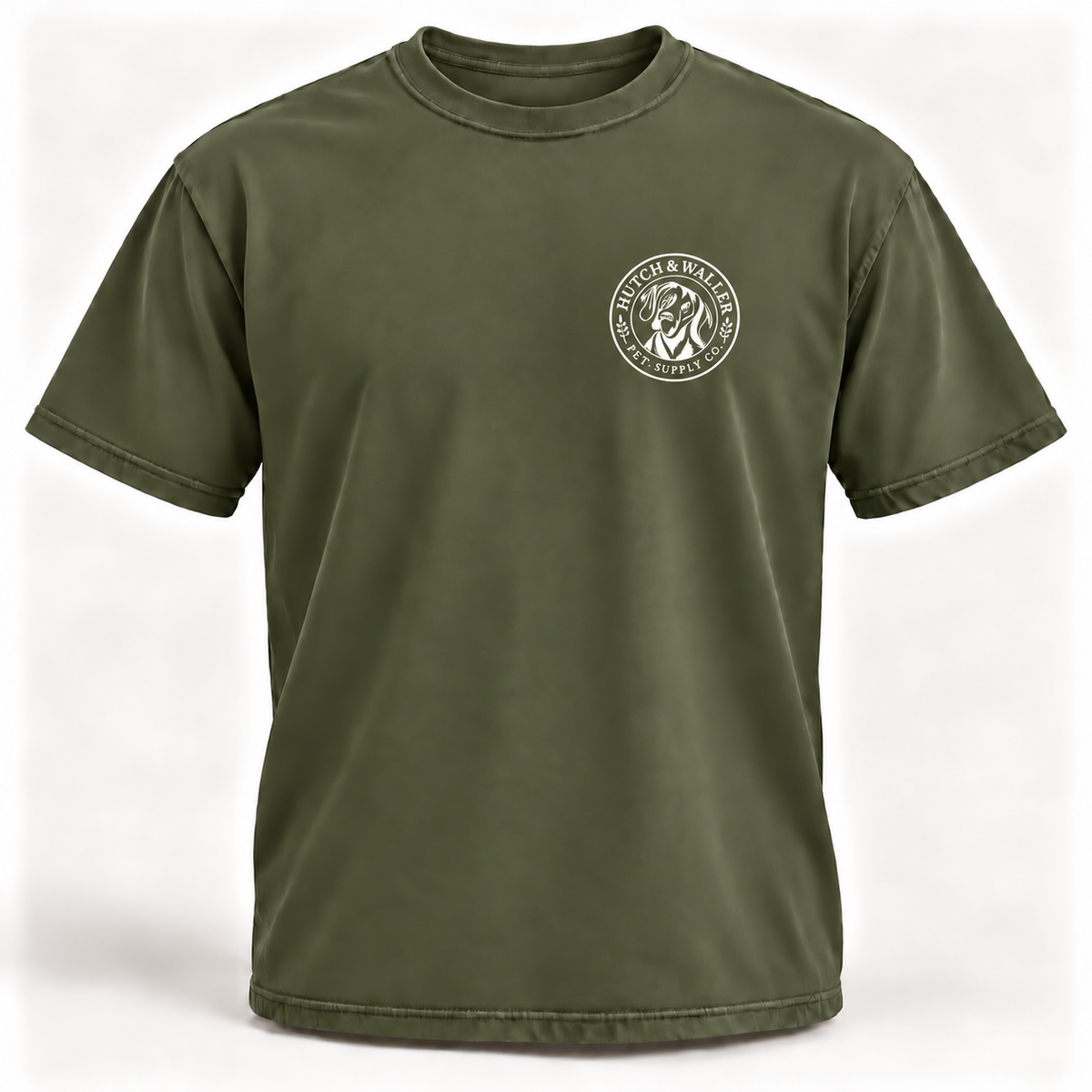 Hutch & Waller Classic Badge T-Shirt in Moss, white single-color left-chest badge, revised mockup
