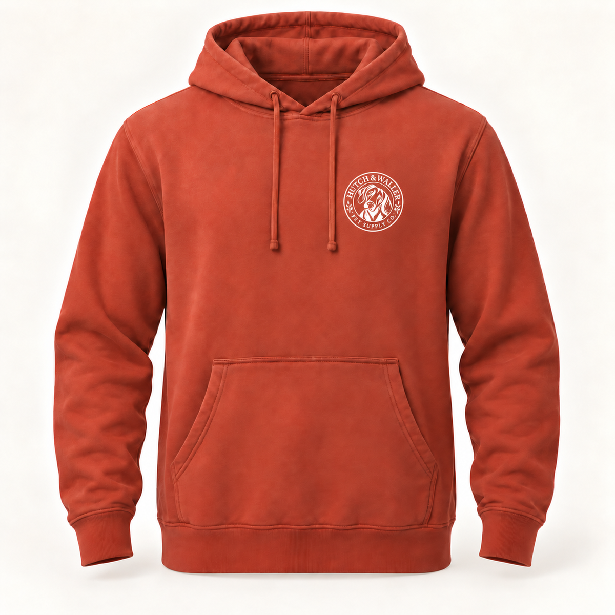 Hutch & Waller Classic Badge Hoodie in Pigment Amber, white single-color left-chest badge, revised mockup