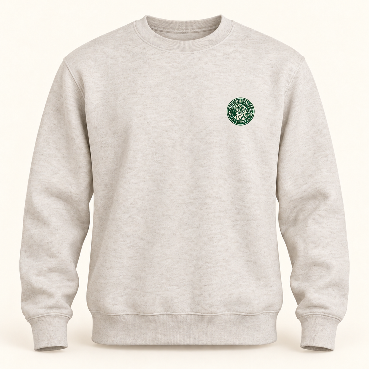 Oatmeal crewneck with forest-green Hutch & Waller chest badge